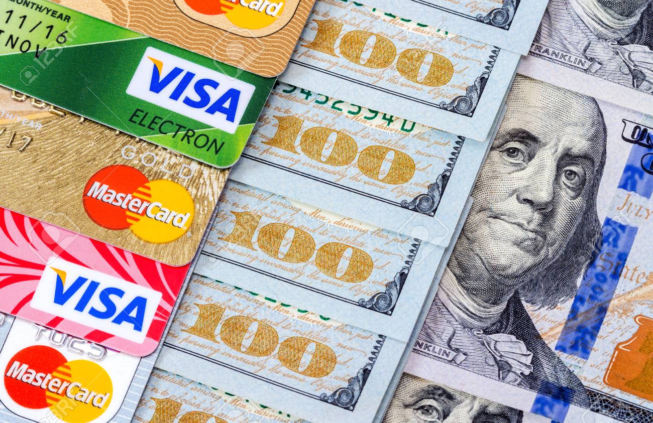 US dollar bills with credit cards Visa and MasterCard